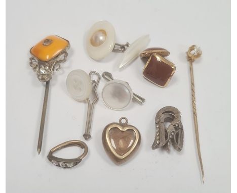Miniature gilt-coloured and enamel heart-shaped memorial pendant enclosing hair with single white stone to reverse (purple en