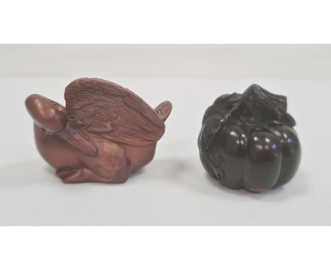 Japanese carved boxwood netsuke&nbsp;in the form of a sitting duck, signed on mother-of-pearl circular panel, 4cm high and a&