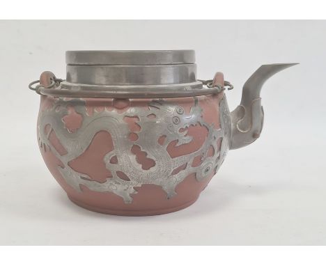Redware and white metal clad teapot with twin metal loop handle, dragon decorated