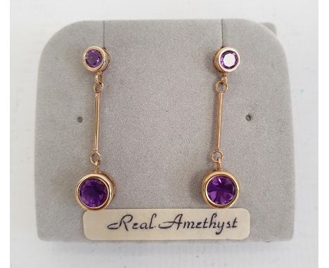 Pair 9ct gold and amethyst drop earrings, each set pair graduated stones Condition ReportButterfly backs