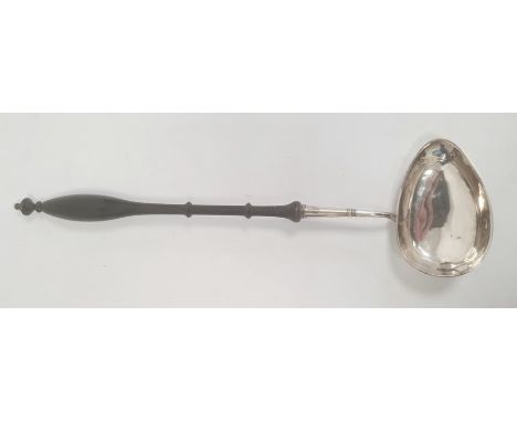 A silver and turned wooden handled punch ladle, possibly Swedish, marks worn, three crown mark, 40.5cm long approx.