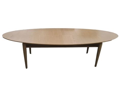Two modern IKEA Stockholm oval coffee tables in oak finish, on four turned supports and light oak coffee table with rounded e