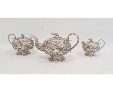 Early 20th century Anglo Indian three-piece tea set comprising teapot, two-handled sugar bowl and milk jug, elephant finials,