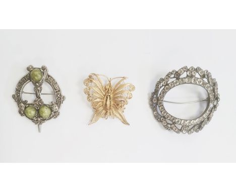 A gold coloured filigree brooch of a butterfly, a Celtic style brooch and a paste buckle/brooch (3)&nbsp;