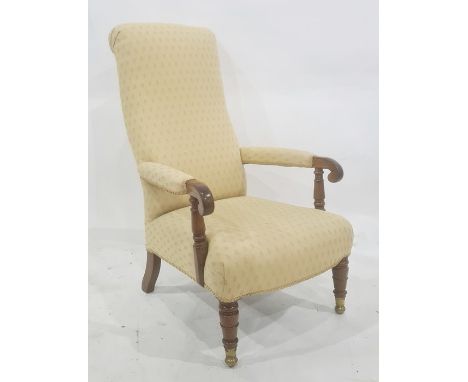 Late Georgian mahogany framed armchair in pale yellow patterned upholstery, turned front legs, unusual brass caps and roller 