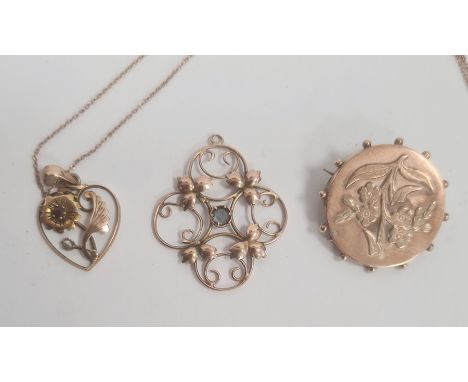 Gold, ruby and pearl heart-shaped pendant, floral design and pierced, on fine chain, a 9ct gold circular brooch, floral decor