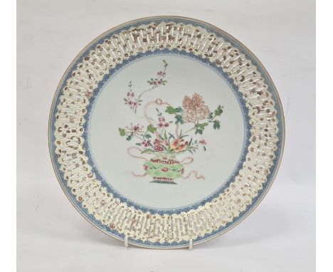 Chinese porcelain shallow dish with pierced border, the centre painted in enamel with chrysanthemum and other flowers in a va