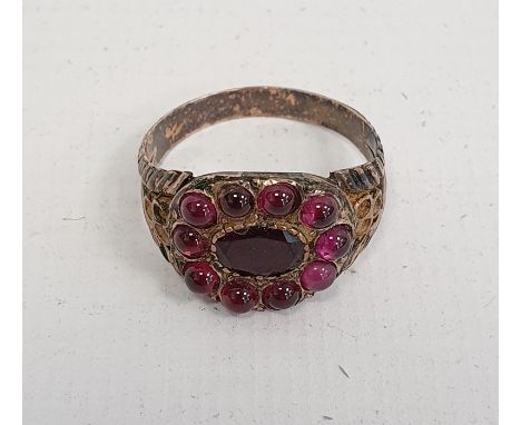 Probably Victorian garnet dress ring, unmarked, yellow metal setCondition ReportThree missing stones to either side Can't con