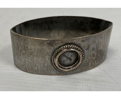 A Liberty &amp; Co silver napkin ring,&nbsp;oval navette form,&nbsp;hammered detail (circular enamel missing), Birmingham 193
