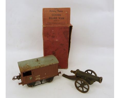 Hornby carriage in box and a model cannon (2) 