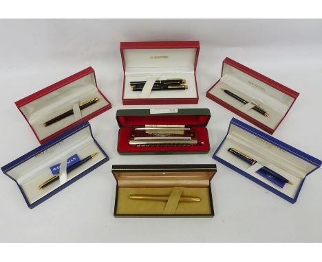 Assorted fountain pens including Sheaffer and Waterman and a Hohner Super Chromonica chromatic harmonica 