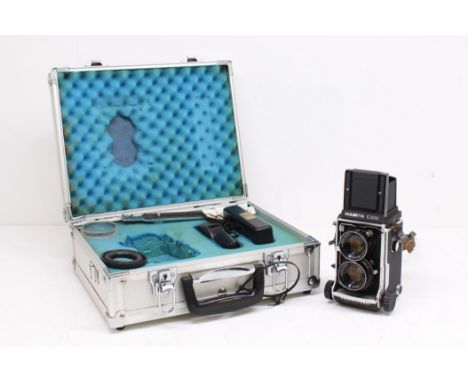 Mamiya: A Mamiya C220 Professional medium format TLR camera body, B40618, generally appears in good order, in need of a clean