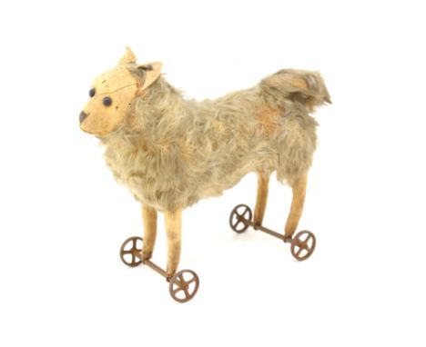 Steiff: A Steiff animal on wheels, circa 1905, mohair plush, felt face, ears and legs, shoe button eyes, stitched mouth, slig