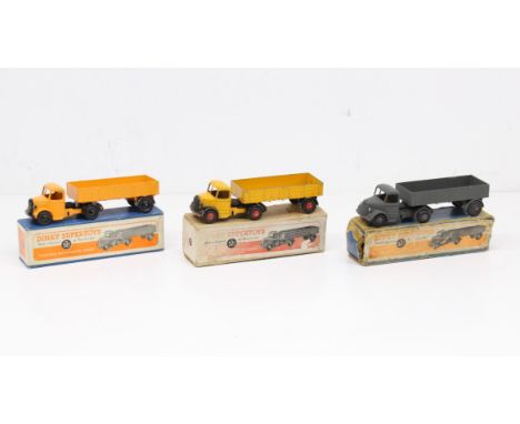 Dinky: A collection of three boxed Dinky Supertoys, Bedford Articulated Lorry, Reference No. 521. One in paintworn yellow, th