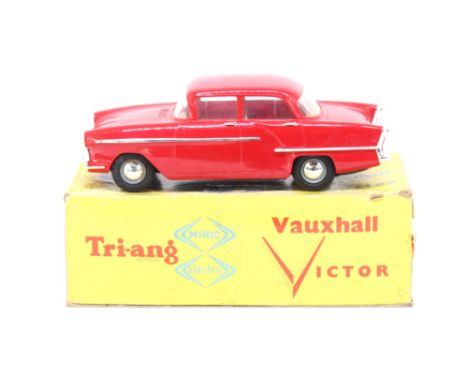 Tri-ang: A boxed Tri-ang Minic Electric, Vauxhall Victor, 1/20 Scale. Red livery with tartan interior. Original box, wear to 