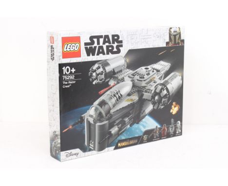 Lego: A boxed Lego Star Wars, The Razor Crest, Reference No. 75292. Box appears sealed as new. Edge wear to box but generally