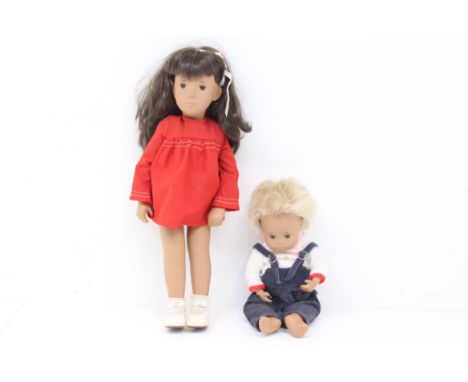 Sasha: A pair of Trendon Sasha, articulated dolls to comprise: a brunette doll in red dress, Reference 104; and a Gregor baby