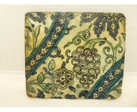 Damascus pottery tile. Ottoman Syria, possibly C17th. Stonepaste with under glaze polychrome decoration. Detail includes Grap