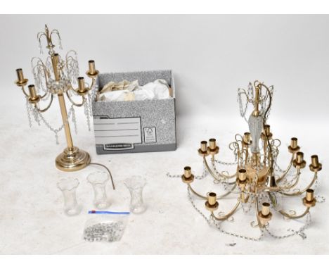 A modern twelve branch moulded glass and gilt metal ceiling light together with a similar six branch table lamp with glass dr