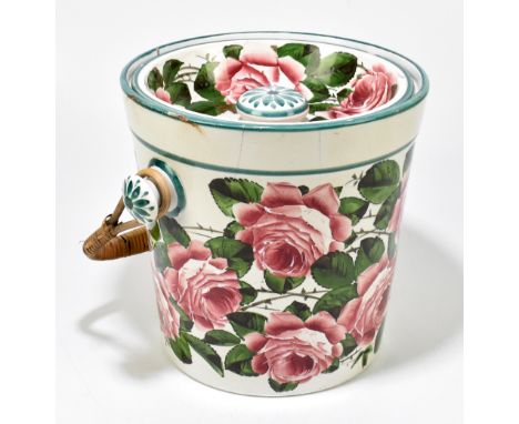 WEMYSS; a large pink rose decorated slop bucket and cover with rattan handle, impressed marks to base and also retail stamp f