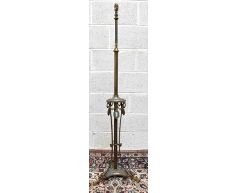 A 19th century brass adjustable standard lamp with cast decoration of swags and bows, set with three jasper ware oval panels 