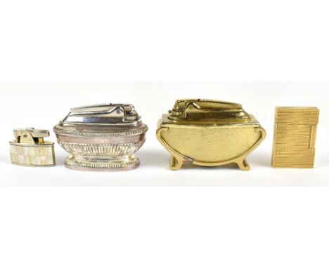 S L DUPONT; a gold plated lighter together with three further lighters including two table examples.