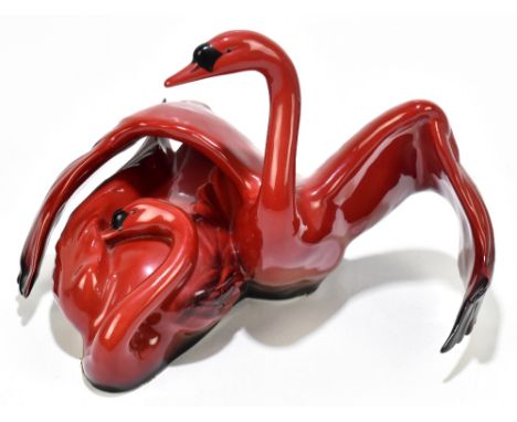ROYAL DOULTON; a flambé figure from the Images of Fire collection 'Nestling Down', height 20cm.Additional InformationLight we