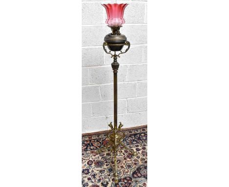 An early 20th century brass adjustable oil lamp with Hinks patent reservoir, height 146cm (converted to electricity).Addition