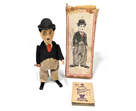 SCHUCO; a tinplate clockwork figure of Charlie Chaplin with box, with felt clothes, height 16cm (2).PROVENANCE: The Collectio