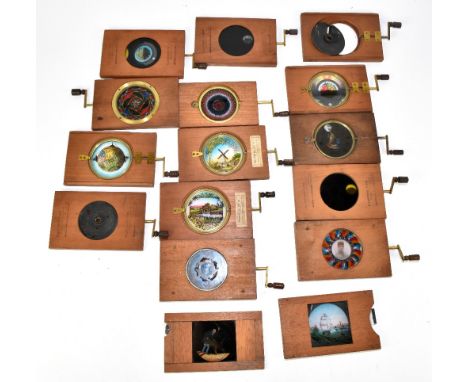 MAGIC LANTERN SLIDES; a collection of fourteen Victorian mechanical magic lantern slides to include five astronomical slides 