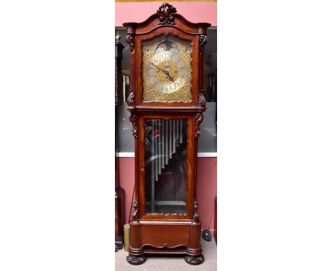 A substantial late Victorian/Edwardian mahogany longcase clock with elaborate scroll dial set with rolling moon, silvered cha