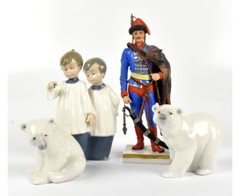 SITZENDORF; a French porcelain figure of a soldier, height 24cm, together with two Lladro figures of polar bear cubs and a Na