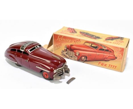 SCHUCO; a FEX 1111 tinplate clockwork vehicle in original box, length 14.5cm (2).PROVENANCE: The Collection of Jack Tempest. 
