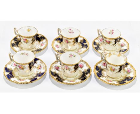 COALPORT; a set of six coffee cans and saucers decorated in the 'Batwing' pattern with floral and gilt detail.Additional Info