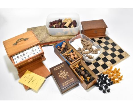 A collection of assorted vintage games including a cased mahjong set, various chess sets, with a stone chess board, etc.