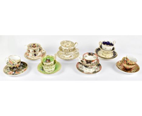 Six 19th century hand painted porcelain trios including a Rockingham style example with floral detail, a Spode Imari example,
