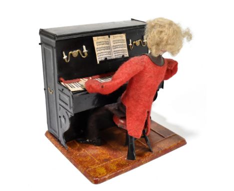 FERNAND MARTIN; an early 20th century French tinplate clockwork musical figure of a gentleman playing piano, with felt clothe