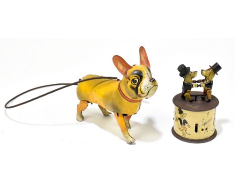 BLOMER & SCHULER; a German tinplate function-powered walking Pug dog, length 18cm, with a German tinplate clockwork toy of tw
