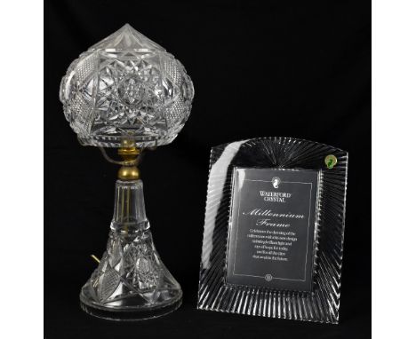 A cut glass mushroom lamp and shade, height 45cm, together with a Waterford crystal 'Millennium' frame, 27 x 21.5cm, boxed (2