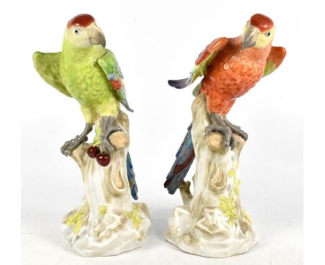 BIDASOA; a pair of Spanish porcelain figures of parrots perching on naturalistic plinth bases, signed, height 37cm (2).Additi