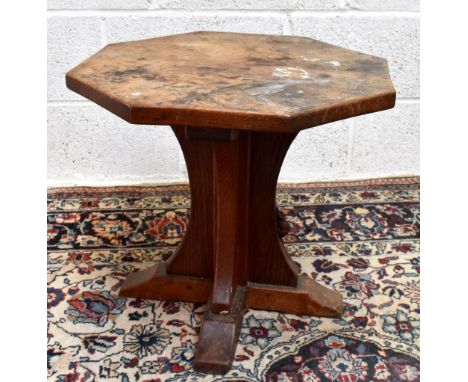 WORKSHOP OF ROBERT MOUSEMAN THOMPSON; an octagonal topped coffee table on swept feet, height 46cm, width 50.5cm.Additional In