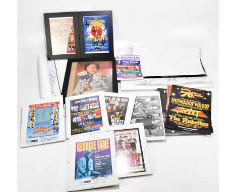A collection of showbiz and musical ephemera including a photograph and poster of Ken Dodd, both signed, eight autographed po