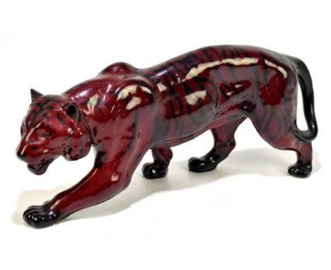 ROYAL DOULTON; a flambé model of a stalking tiger, length 35cm.&nbsp;Additional InformationLight wear to the glaze, there are