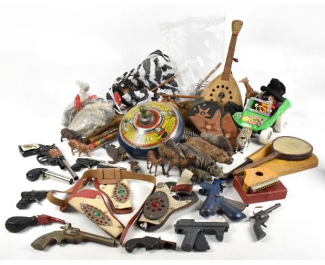 A miscellany of vintage toys to include a spinning top, various guns, a table top croquet set, etc.PROVENANCE: The Collection