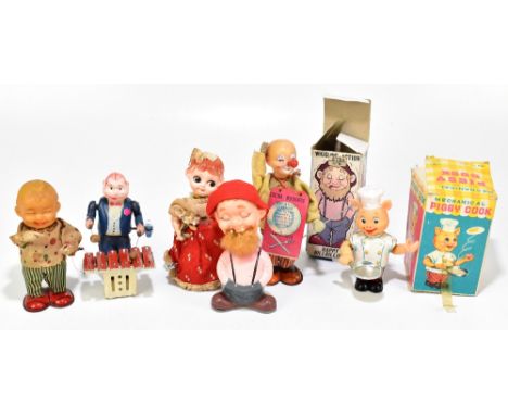 A collection of five Japanese tinplate clockwork toys comprising man with a xylophone, Bo Peep, a clown possibly Nomura Toys,