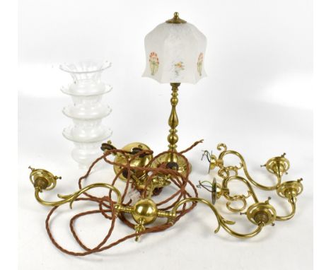 An early 20th century brass rise and fall twin branch ceiling light and a similar pair of wall lights, each with frosted and 