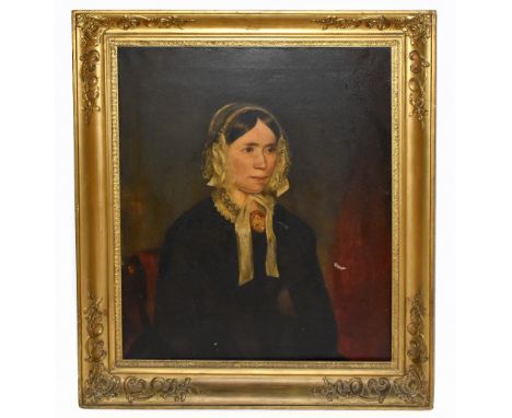 19TH CENTURY BRITISH SCHOOL; oil on canvas, portrait of a Victorian lady wearing a black dress with central cameo brooch, app