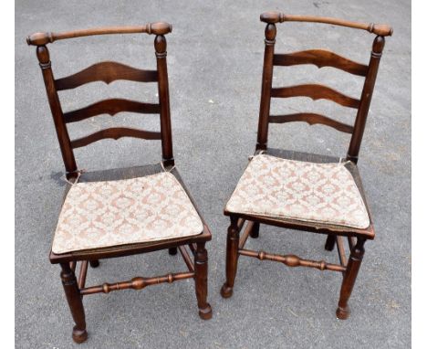 Six 19th century Macclesfield ladder back rush seated chairs.