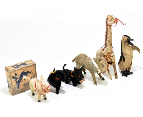 A collection of six vintage clockwork animals comprising a Fairylite 'Steady Neddy' in original box, two German clockwork dog