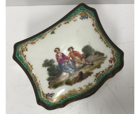 A 19th Century Meissen type trinket box of shaped form with decoration of a courting couple in a landscape to the lid within 